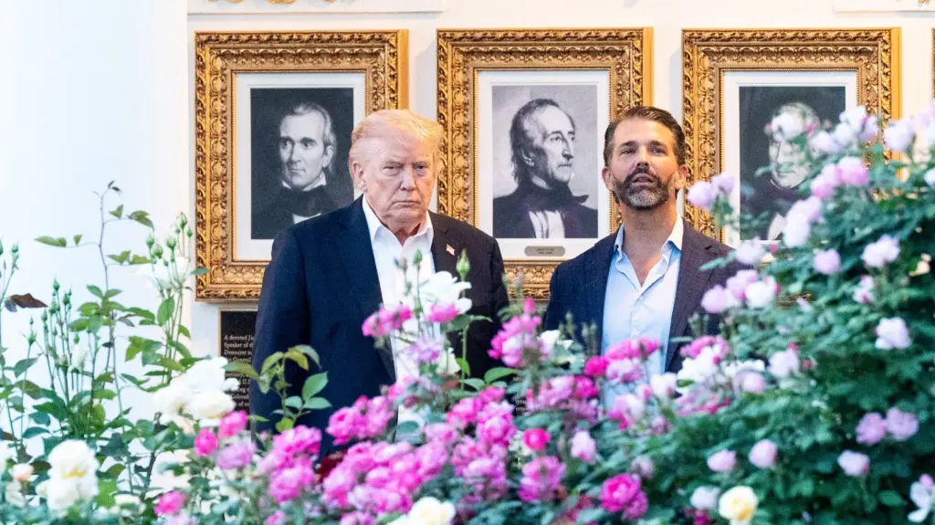 President Donald Trump and his son Donald Trump Jr. standing in the West Colonnade of the White House in Washington, DC.