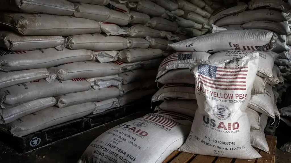 Stacked bags of split yellow peas labeled with the