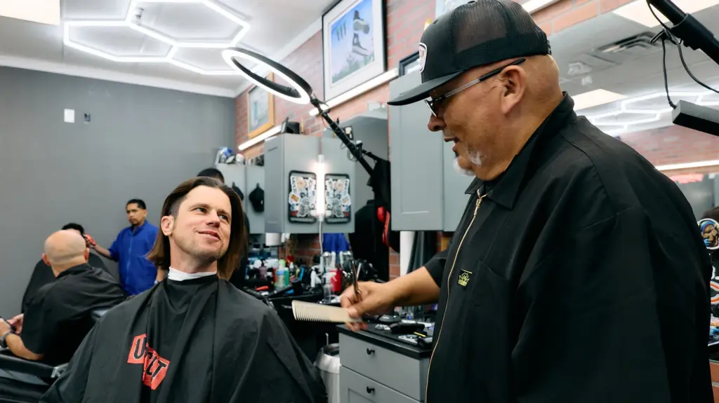 The author (left) in a Las Vegas barbershop, April 2026