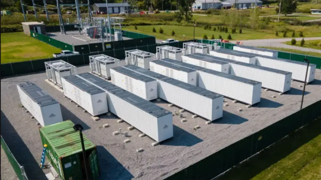 Rows of large white lithium battery storage containers.