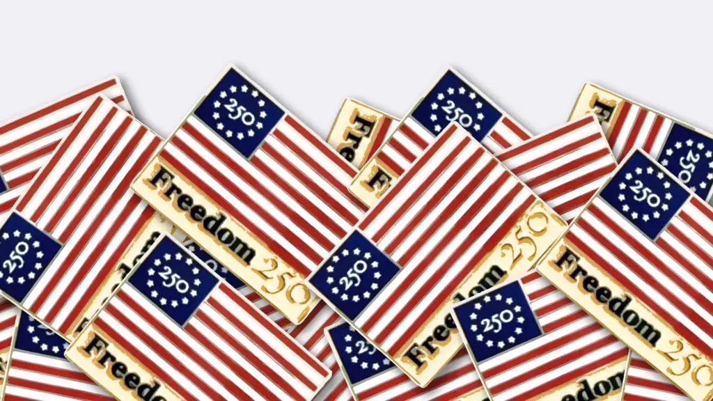 A photo illustration of a bunch of pins based on the American flag. The pins have red and white stripes with