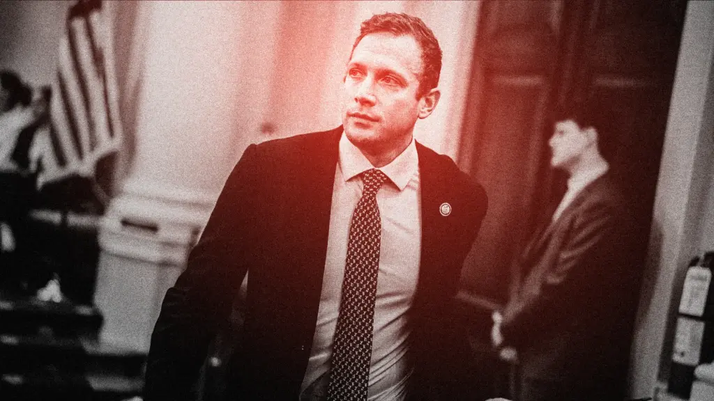Congressman Max Miller is shown walking down a hallway in DC; the photo has been treated with a black and red grainy filter.