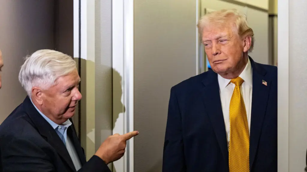 Senator Lindsey Graham gestures to Donald Trump