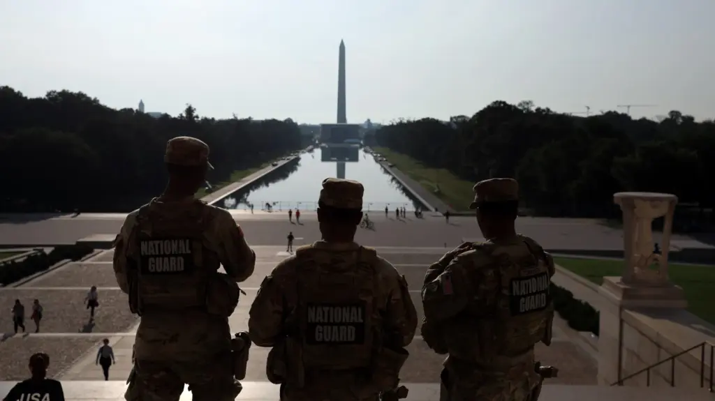 National Guard troops look toward the reflecting pool