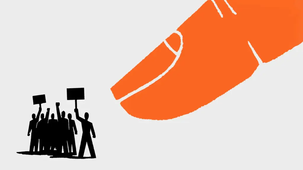An illustration of a huge orange index finger pointing at a group of much smaller protestors.