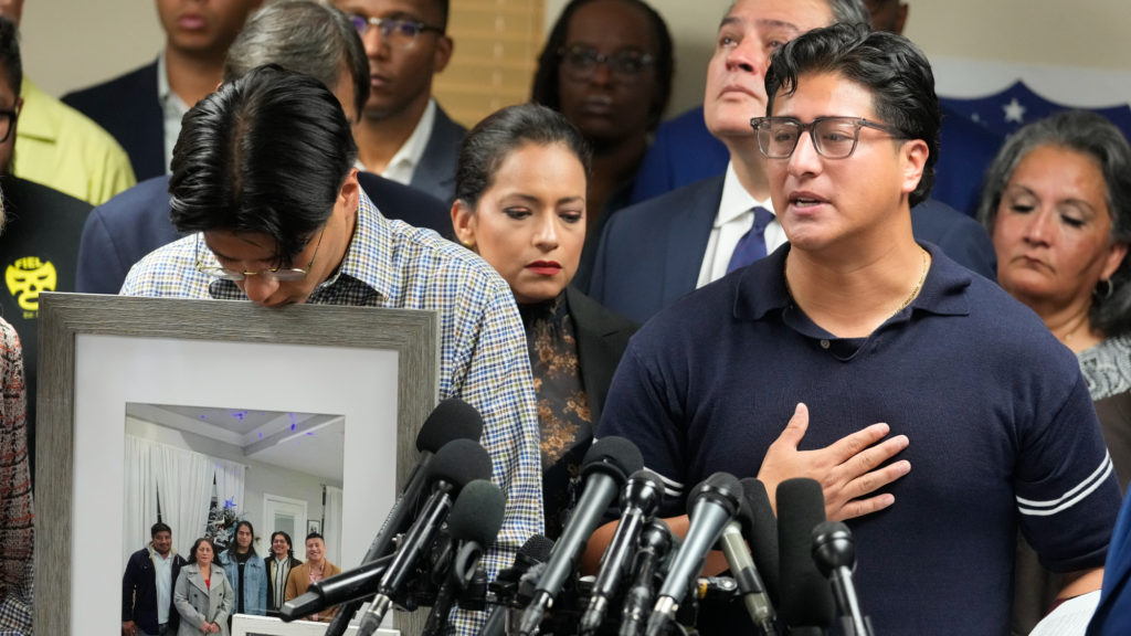 Lorenzo Salgado Jr., left, and Ronaldo Salgado, right, sons of Lorenzo Salgado Araujo, are shown during a news conference about the ICE shooting death of their father in Houston Wednesday, July 8, 2026.