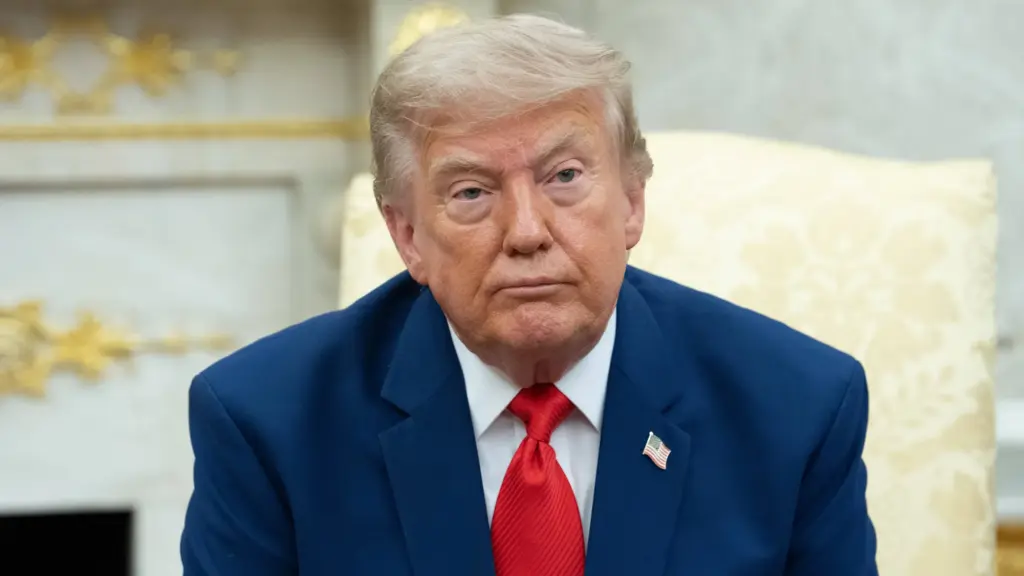 President Trump seated in the Oval Office.