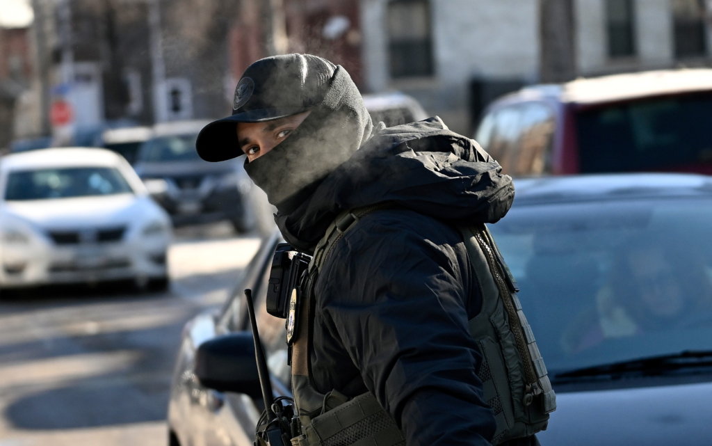 A masked ICE agent.