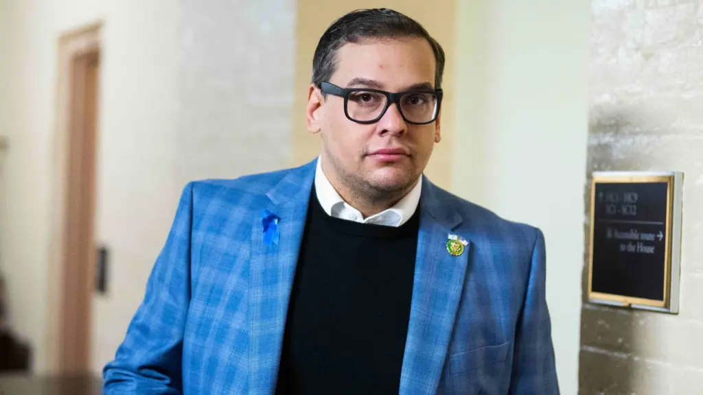 George Santos wears a blue suit jacket.