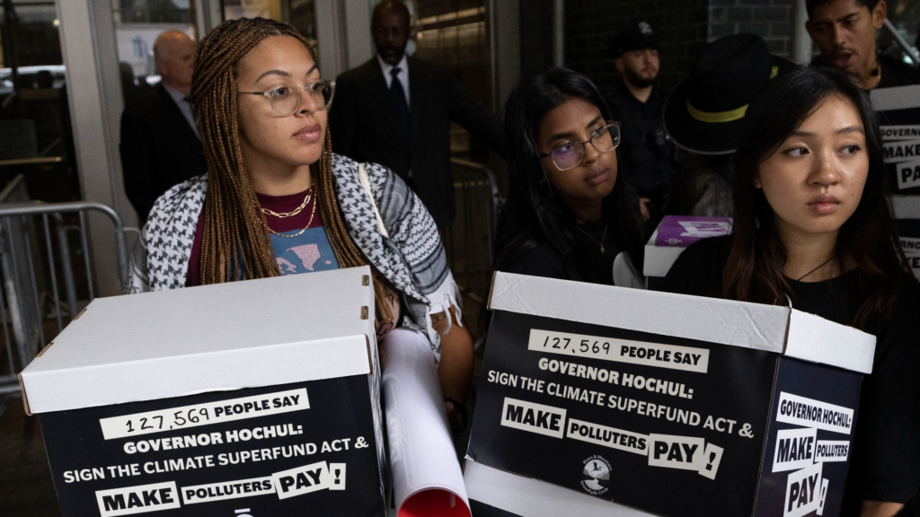 Two activists at demonstration at Hochul's office