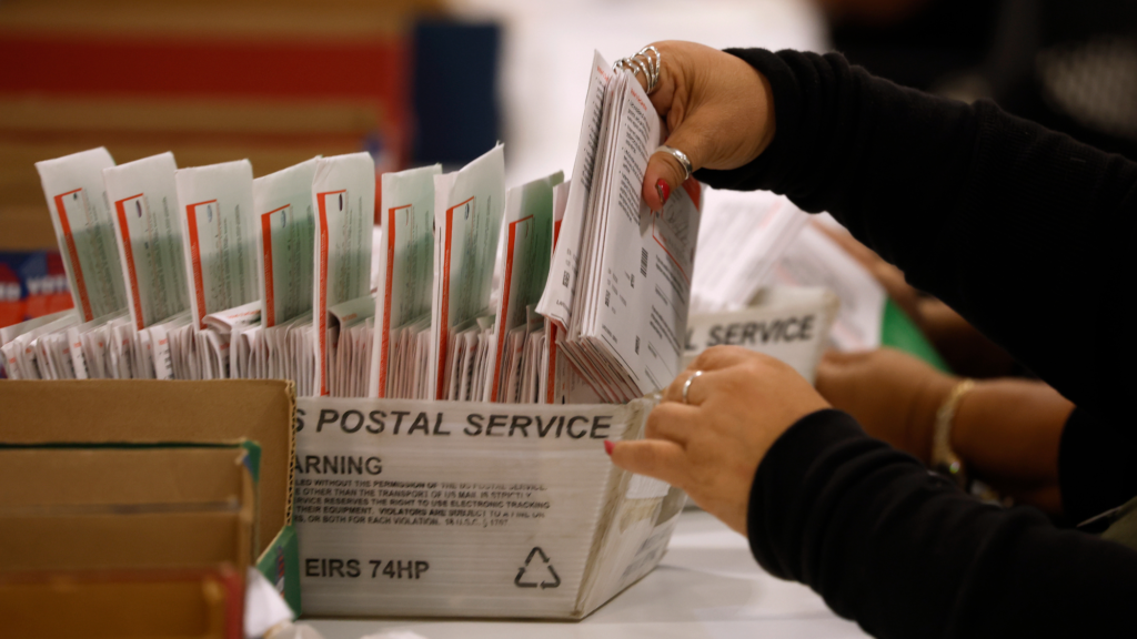An election worker processes mail-in ballots for the California state primary election at the Los Angeles County Ballot Processing Center on June 05, 2026 in City of Industry, California.
