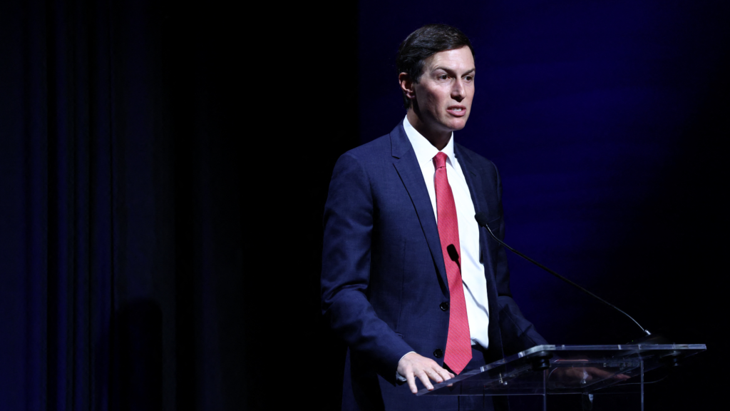 Jared Kushner at a podium.