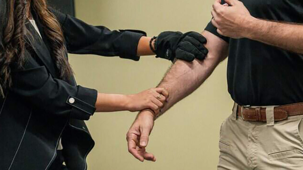 Lt. Will Veron, right, participates in an electric glove demonstration during a news conference at the Sacramento County Sheriff's Office Headquarters on Thursday, Aug. 27, 2026.